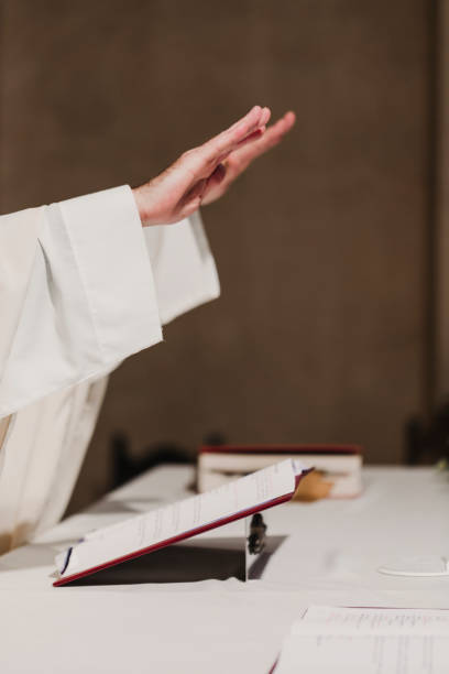 istock unrecognizable Priest holding the goblet during a wedding ceremony nuptial mass. Religion concept 1203032696
