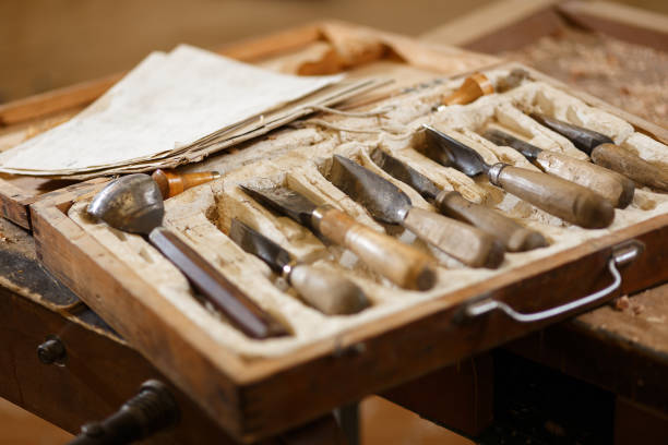 istock Set of carpenters tools in workshop. Crafting table with instrument. 1203033925
