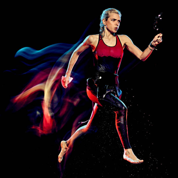 istock woman triathlon triathlete isolated black background 1203035530
