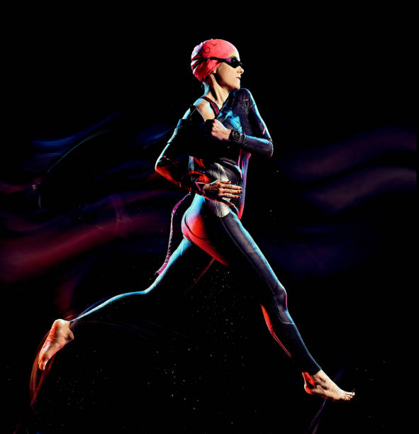istock woman triathlon triathlete isolated black background 1203035551