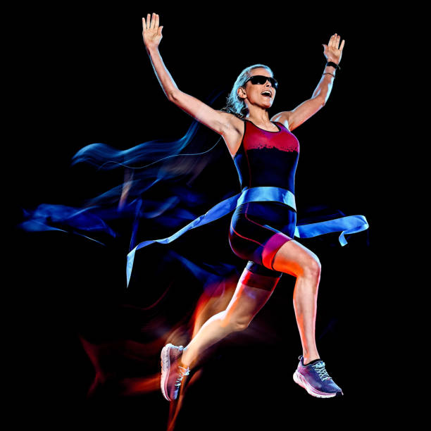 istock woman triathlon triathlete runner running joogger jogging  isolated black background 1203035628