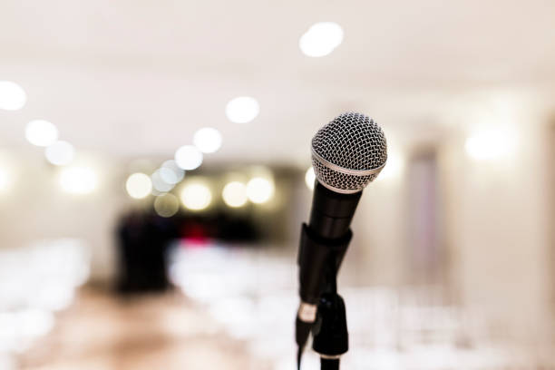 istock Close up old microphone in conference room. Business and company concept 1203036070