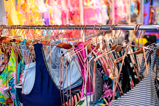 Colorful swimsuits in a row hanging at the trendy shop boutique, Nikon Z7