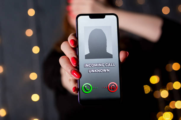 istock Scam unknown caller. Scary number on the display. 1203037187