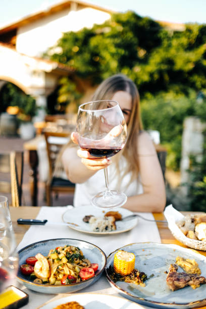 istock Beautiful woman on vacation having lunch 1203037403