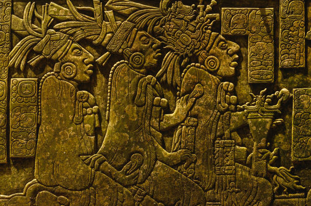 Ancient Mayan drawings on the stone wall Ancient Mayan drawings carved on the stone wall maya temple stock pictures, royalty-free photos & images