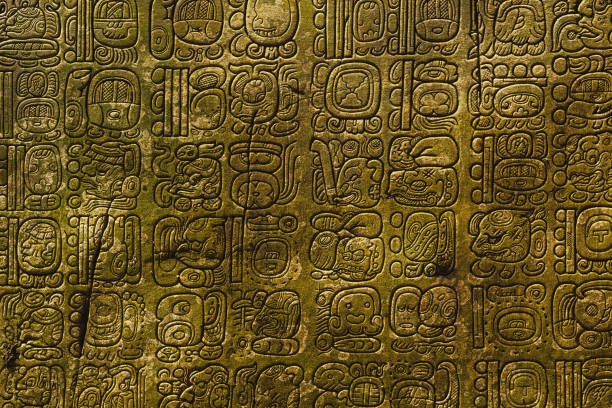 Ancient Maya script Ancient Maya script carved on the stone wall mayan stock pictures, royalty-free photos & images