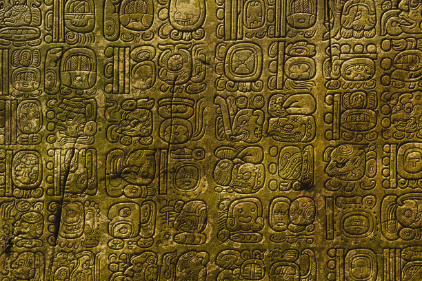 Ancient Maya script Ancient Maya script carved on the stone wall maya temple stock pictures, royalty-free photos & images