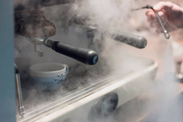 istock Cup of coffee and machine 1203040754