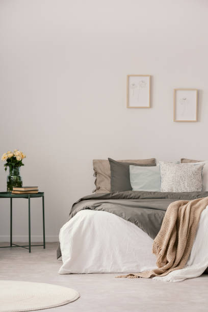 istock Vertical view of modern pastel bedroom interior 1203041638