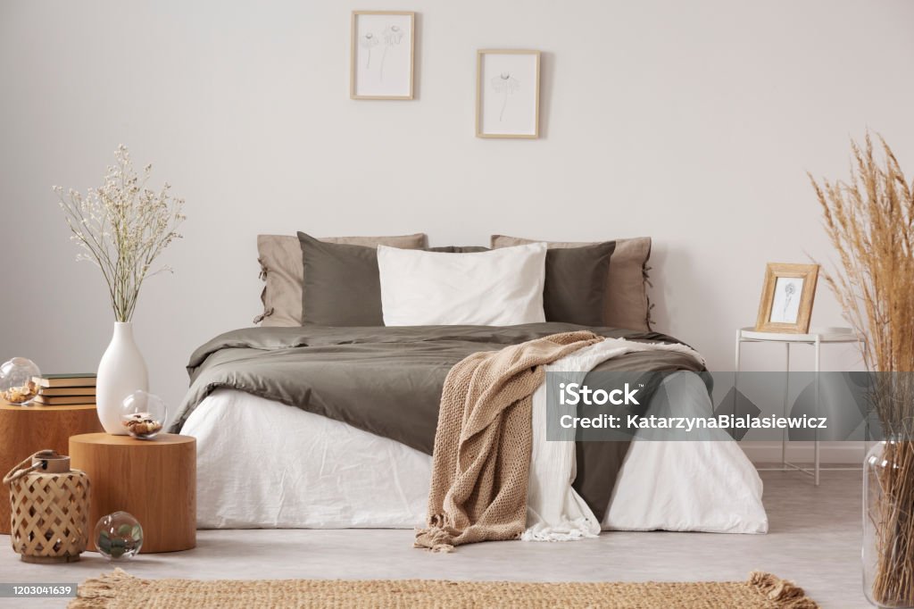 Spacious bedroom interior in beige and olive colour Bedroom Stock Photo