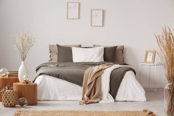 Spacious bedroom interior in beige and olive colour Spacious bedroom interior in beige and olive colour bed decoration stock pictures, royalty-free photos & images