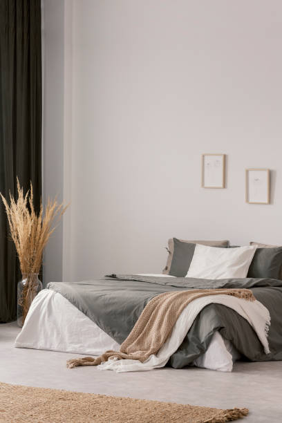istock Elegant bedroom interior with beige carpet on the floor 1203041644