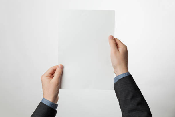 istock Empty A4 paper brochure in hands. White sheet for design 1203041896