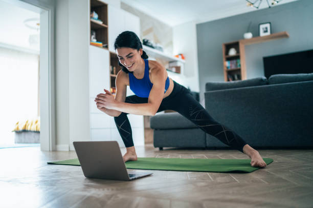Woman working out at home Fit woman doing side lunges indoors in a flat mat photos stock pictures, royalty-free photos & images
