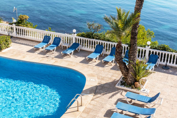 istock Swimming pool and view to the Mediterranean Sea. 1203045353