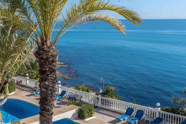 istock Swimming pool and view to the Mediterranean Sea. 1203045357