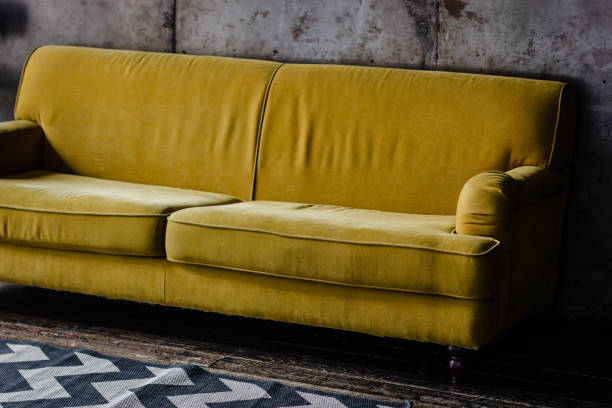 istock Yellow velvet couch in loft room 1203045742