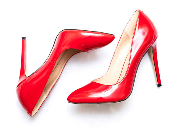 istock beautiful female shiny red stilettos on a white background 1203047007