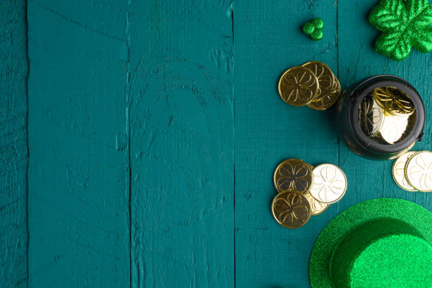 istock Saint Patrick, top view on a green wooden background, with accessories for a celebration 1203050384