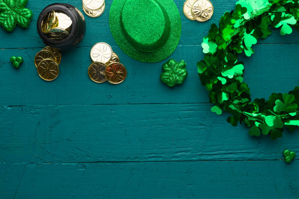 istock Saint Patrick, top view on a green wooden background, with accessories for a celebration 1203051440