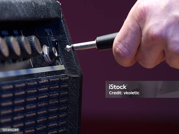 Plugging In Stock Photo - Download Image Now - Amplifier, Plugging In, Close-up