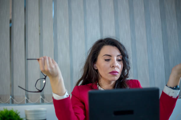 istock Beautiful girl in the office 1203054566