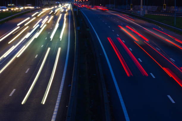 istock traffic on the highway at night 1203054934