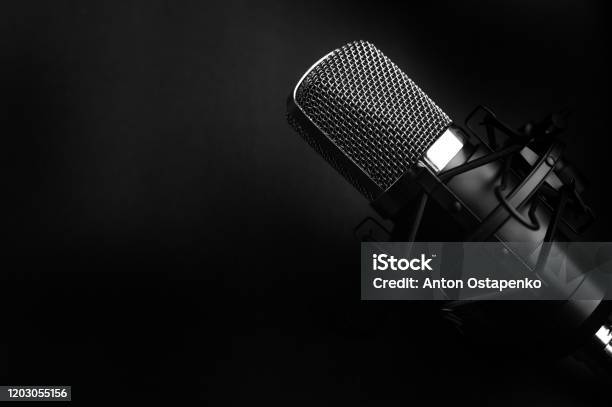 Condenser Black Studio Microphone On A Black Background Streamer Podcasts Music Background Stock Photo - Download Image Now