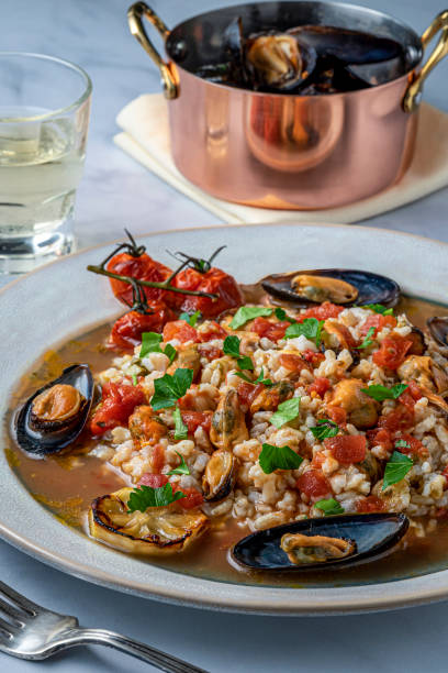 istock Steamed mussels in wine sauce. 1203056401
