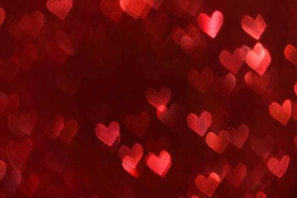 istock Blurry Hearts bright red background Valentine Day background 1203056612