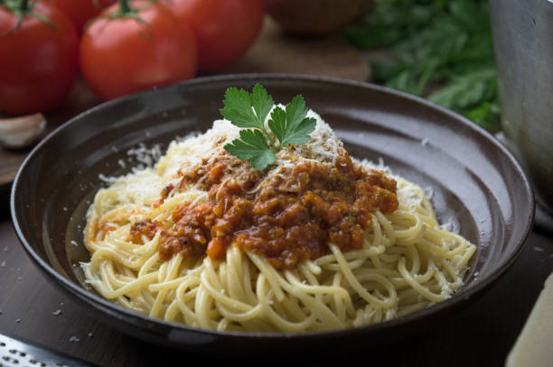 istock tomato sauce bolognese spaghetti with grated cheese 1203058516