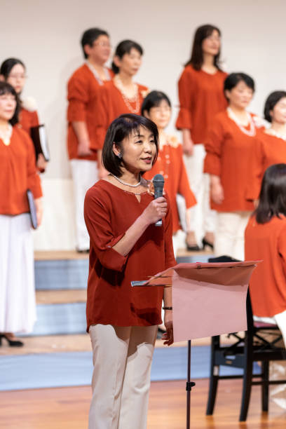 istock Woman making a speech at Christmas concert 1203062327