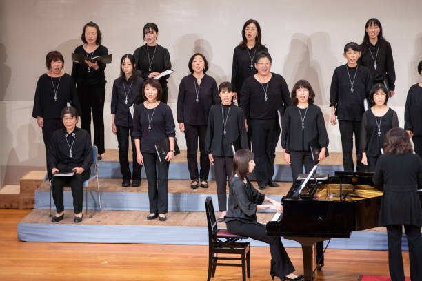 istock Women's chorus concert with piano 1203062499