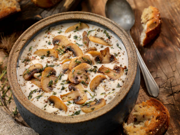 Cream of Mushroom Soup with Roasted Garlic and Thyme Cream of Mushroom Soup with Roasted Garlic and Thyme cream soup stock pictures, royalty-free photos & images
