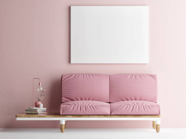 istock Mock up poster with pink sofa, Pink wall background 1203067521