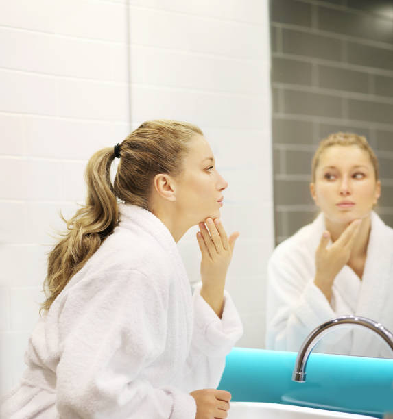 istock Magic anti-aging cream.Applying the cream 1203067523