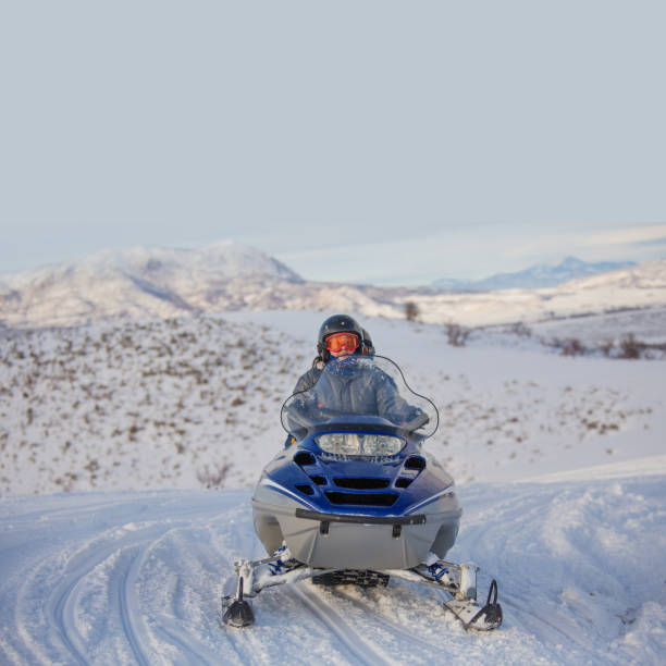 istock Driving snowmobile in Colorado, USA 1203068732