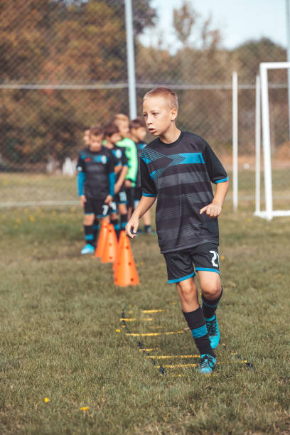 istock Young Player Exercises on Ladder Drills 1203069114