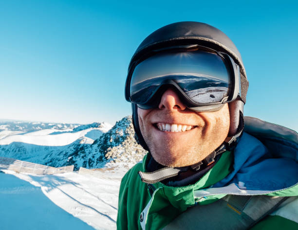 istock Skier man portrait in safe ski equipment 1203073397