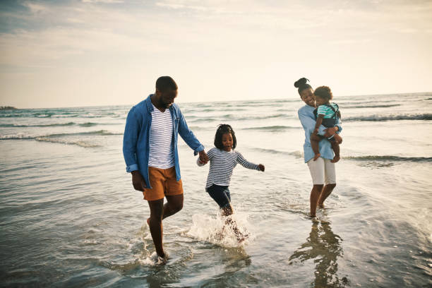 istock Waves of fun with their little ones 1203073682