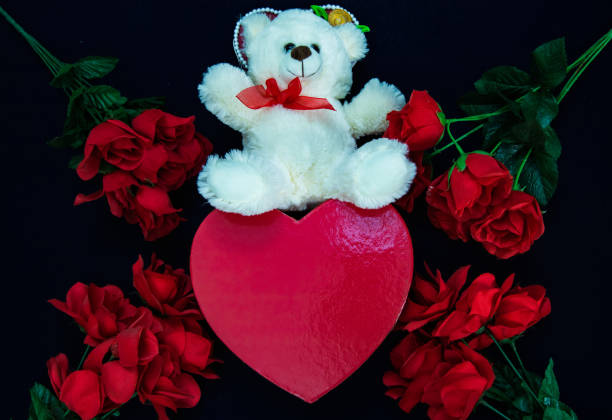 istock Happy valentines day with red rose and cute teddy bear 1203075500