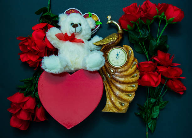 istock Happy valentines day with red rose and cute teddy bear 1203075502