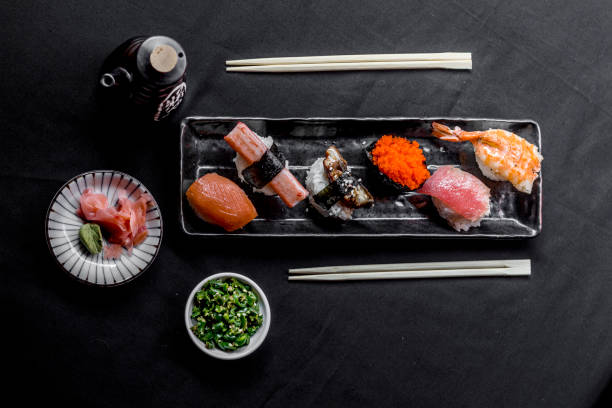 istock Nigiri Sushi Flat lay in black background. 1203075603