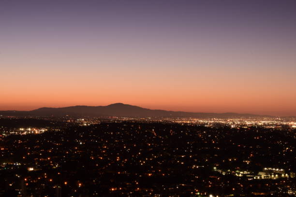 istock Sprawling Illuminated Los Angeles Metropolis Horizon With Mountains During Beautifully Vivid Sunrise 1203076244