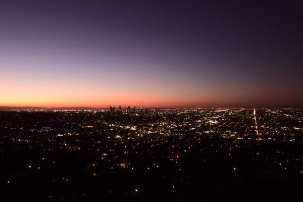 istock Sprawling Illuminated Los Angeles Metropolis Horizon With Mountains During Beautifully Vivid Sunrise 1203076303