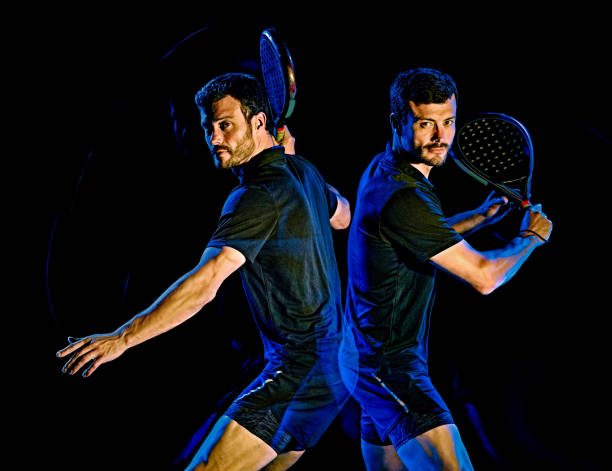 Paddle tennis player man light painting isolated black background