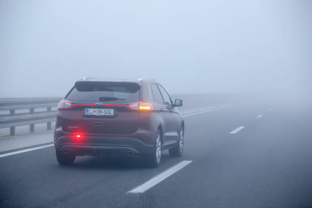 Traffic during thick fog stock photo