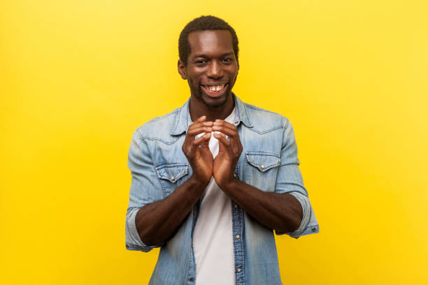 istock Portrait of sneaky devious man thinking cunning idea, planning evil trick. indoor studio shot isolated on yellow background 1203078799
