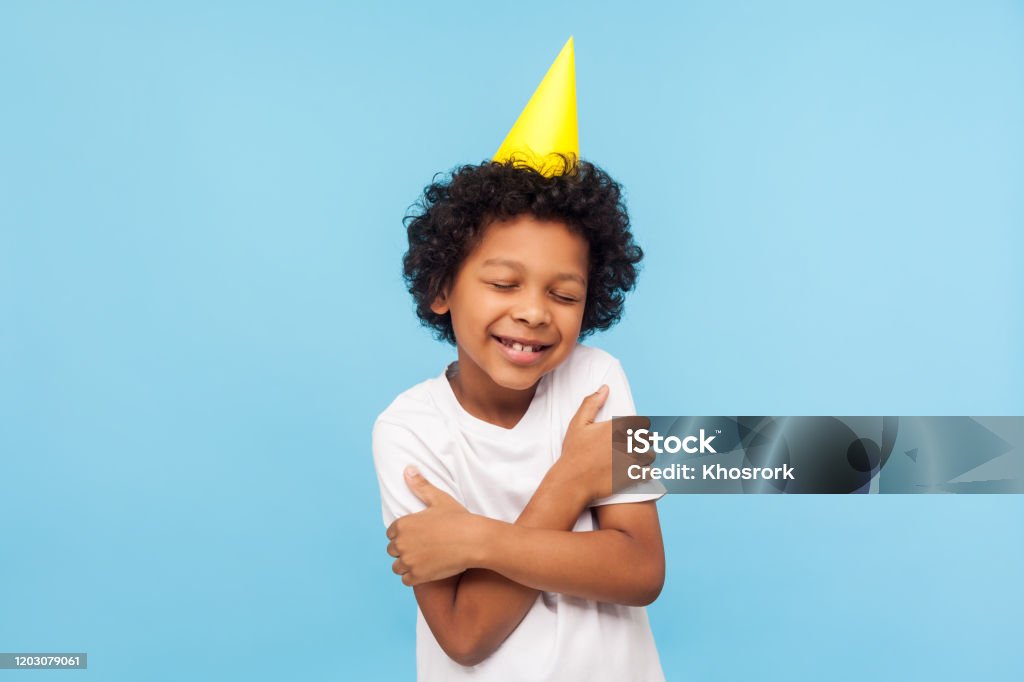 I Love And Congratulate Myself Portrait Of Amazing Lovely Kid With Funny  Party Cone Embracing Himself And Smiling From Pleasure Stock Photo -  Download Image Now - iStock
